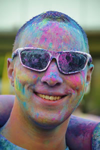 man-covered-in-colourful-paint